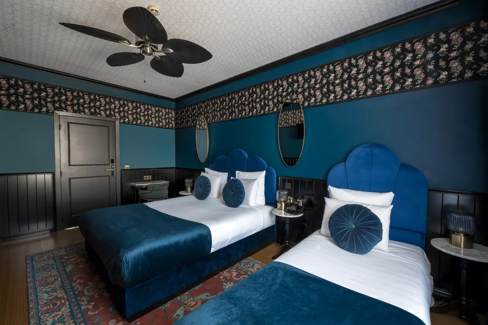 Triple room at Craves Hotel with a double bed and a single bed