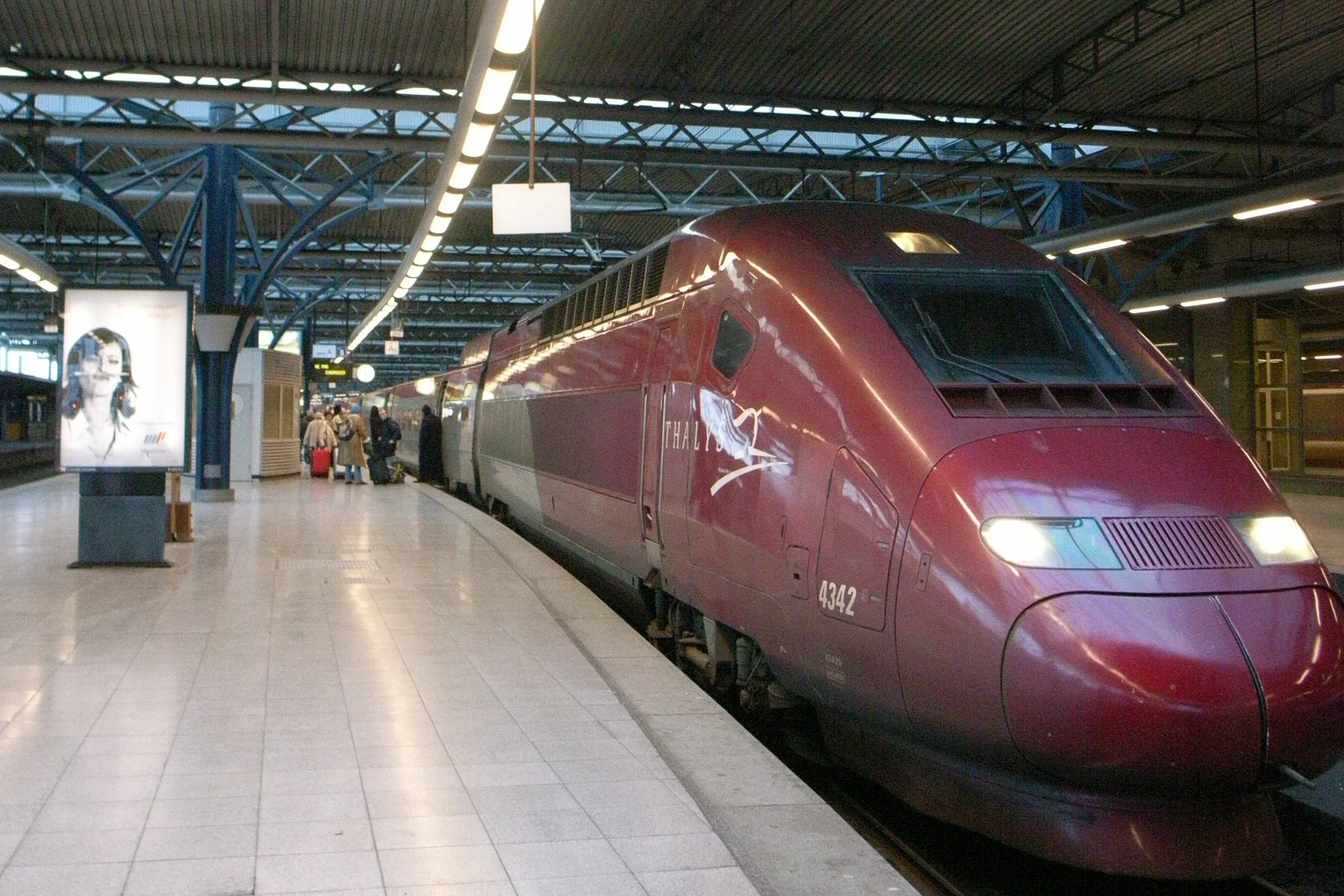 A high-speed train at the platform under the canopy of Brussels-Midi station