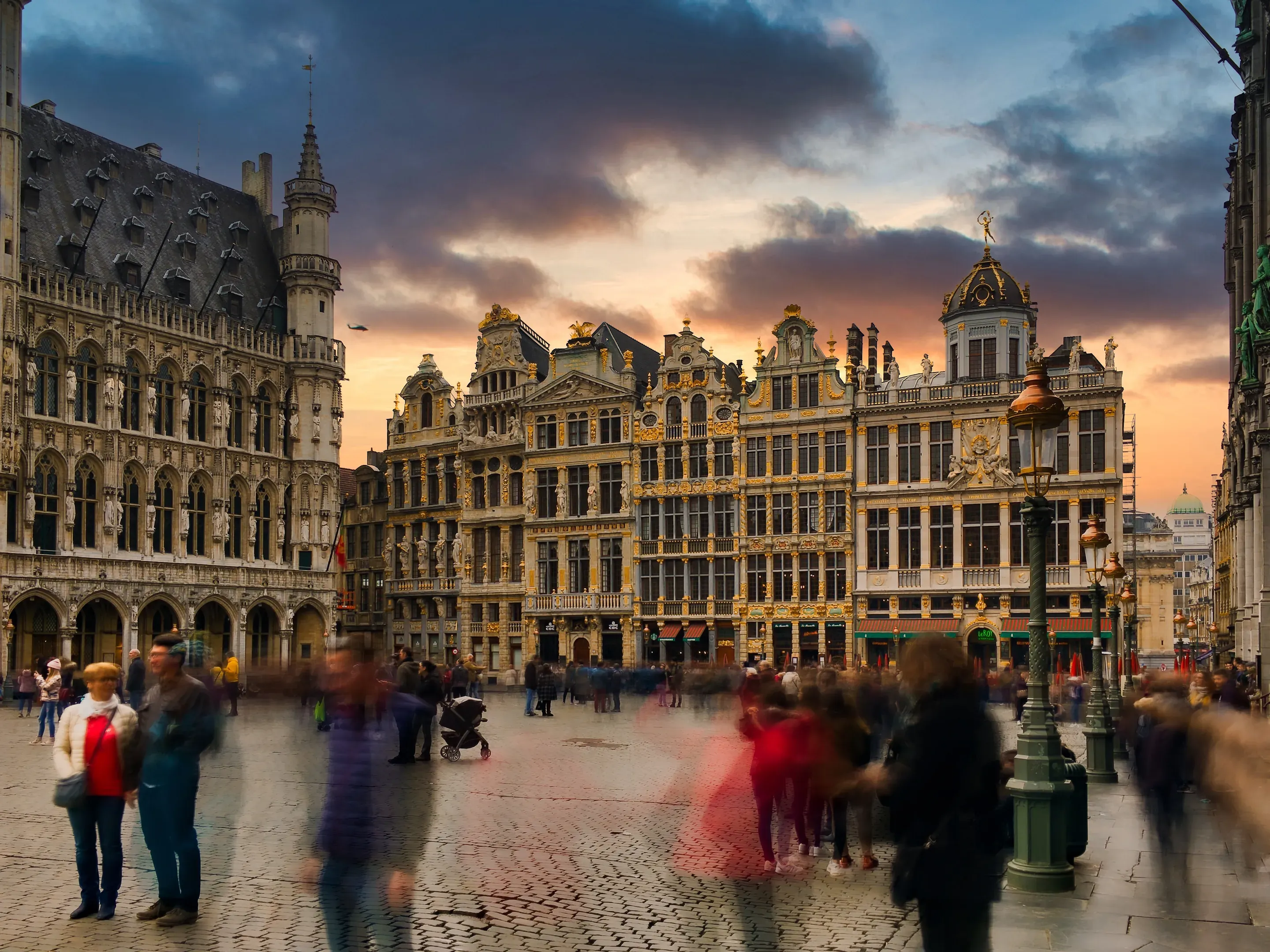 The Grand-Place in Brussels at dusk, with the Town Hall and the guild houses