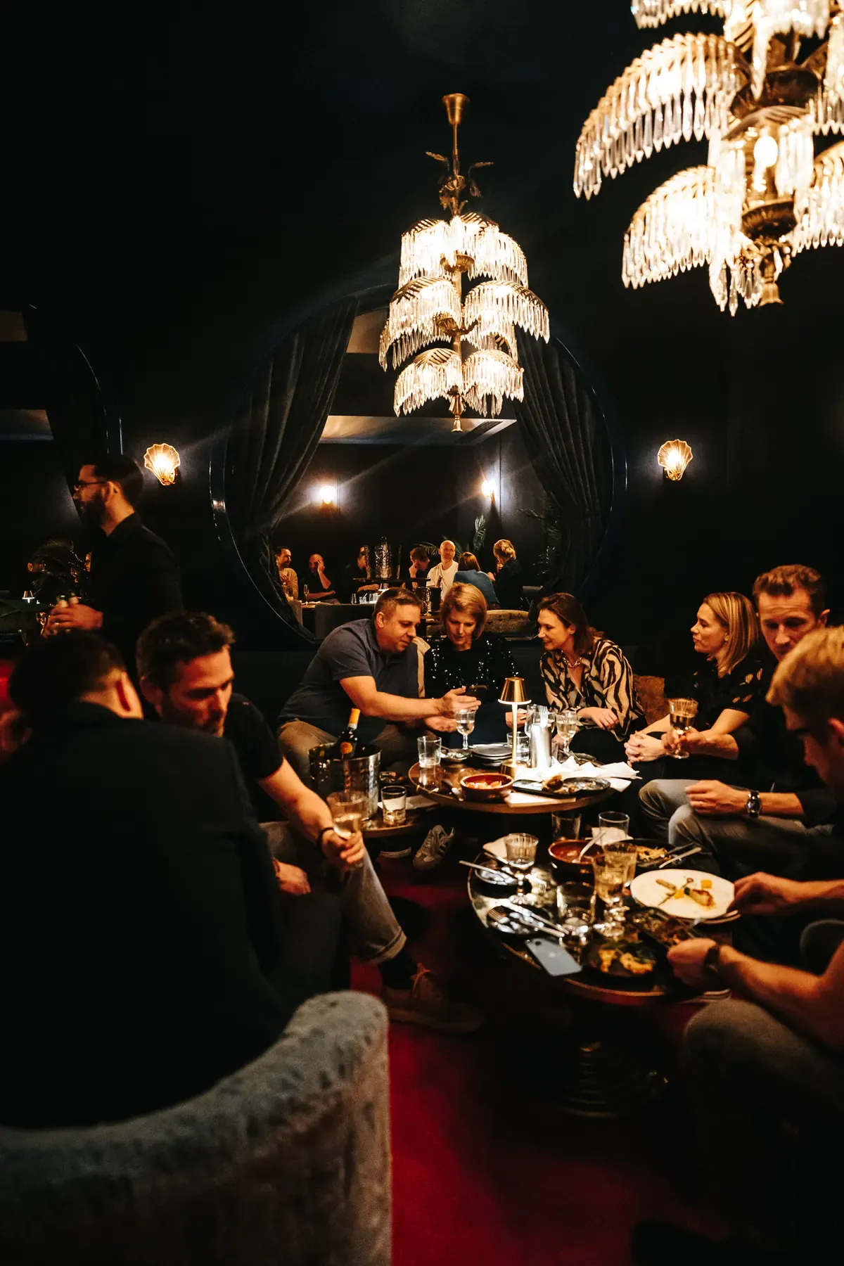 The Scène room beneath the chandeliers, private party